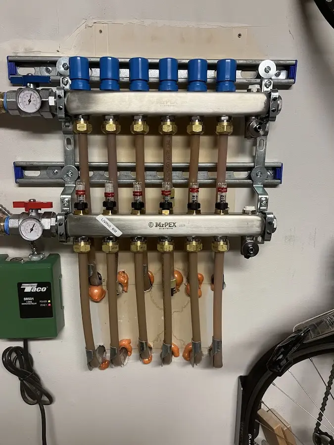 Plumber performing Water Heater Repair at a residential property in Hortonville